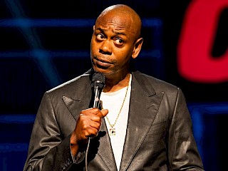 LGBTQ+ Advocates Demand Netflix To Remove Dave Chappelle's New Stand-Up Special